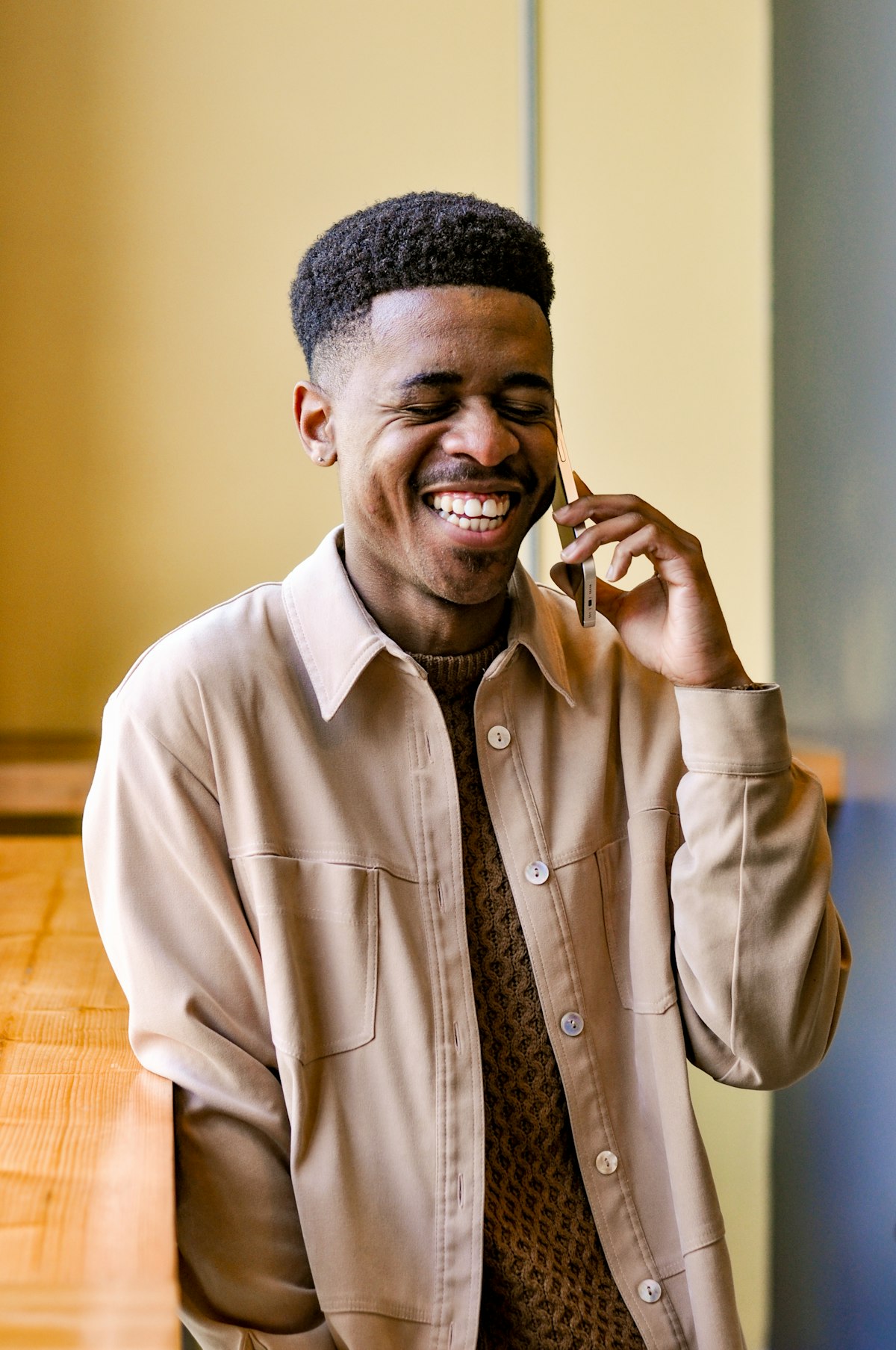 A merchant smiling on a call while his payouts go through